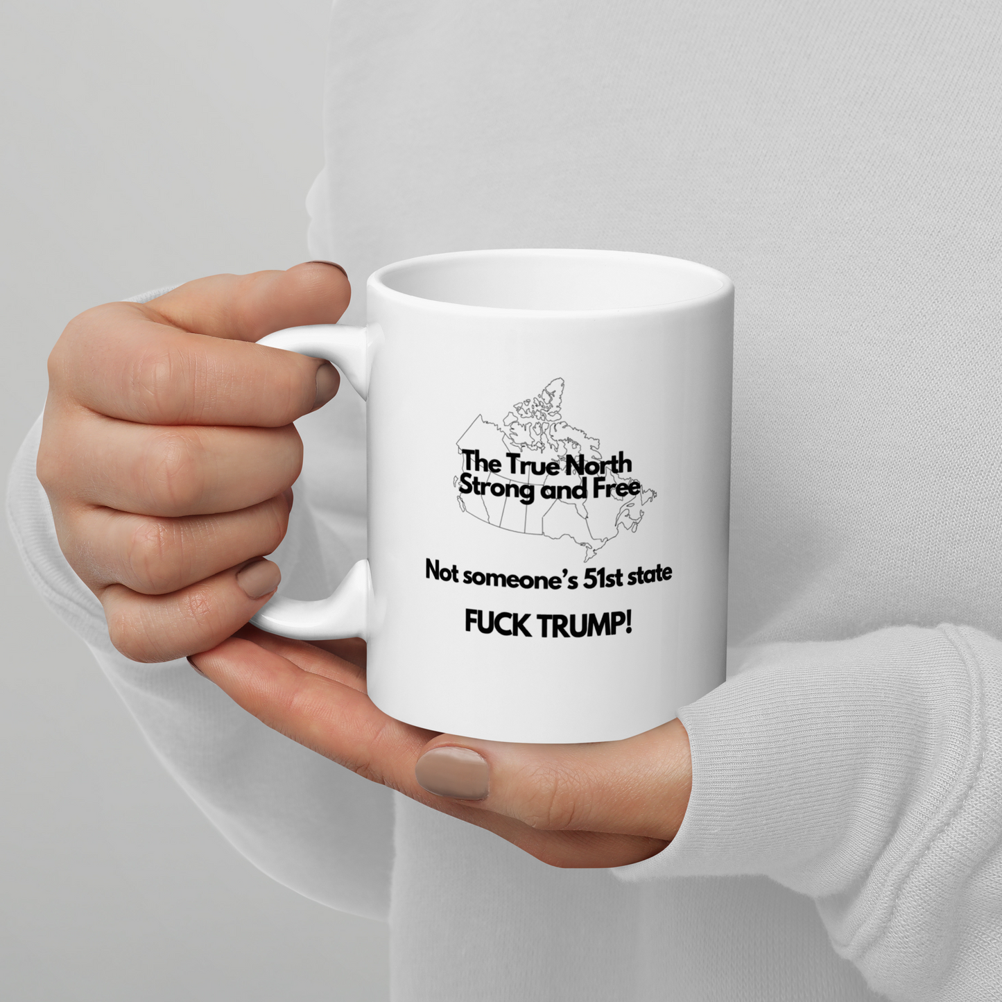 The True North Strong and Free Not someone's 51 State. Fuck Trump, White glossy mug