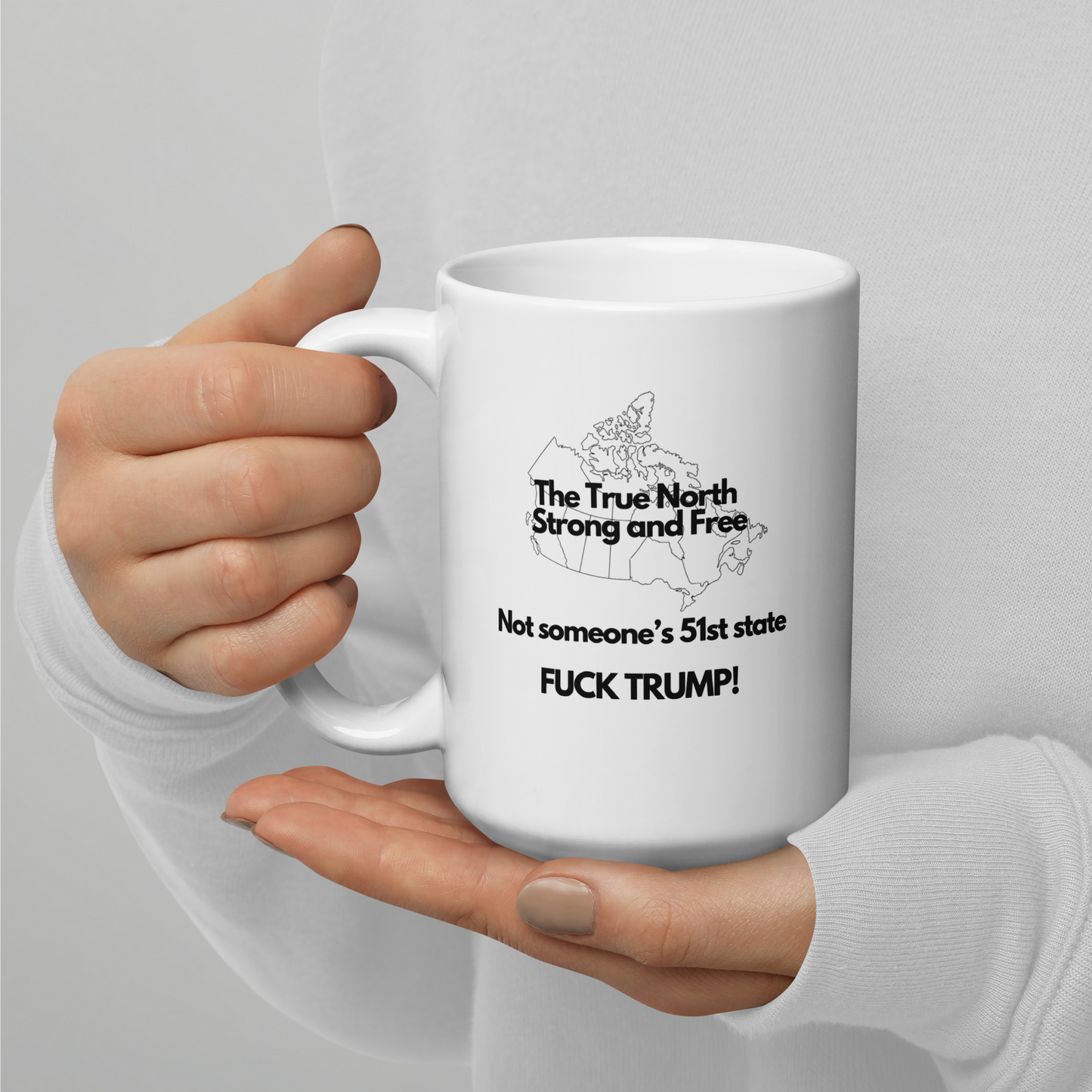The True North Strong and Free Not someone's 51 State. Fuck Trump, White glossy mug